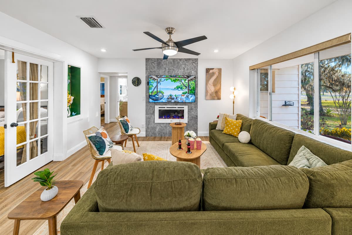 This beautifully appointed living room invites you to relax with its spacious layout, soft textures, and thoughtfully curated furnishings.