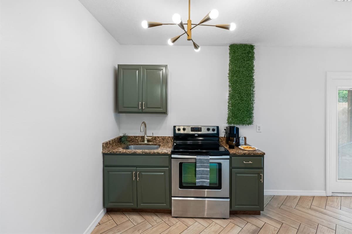 This stylish secondary kitchen is a perfect complement to the main cooking area—ideal for added convenience or entertaining with ease.