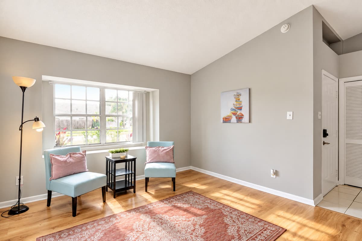 A charming extra seating nook nestled by the window.