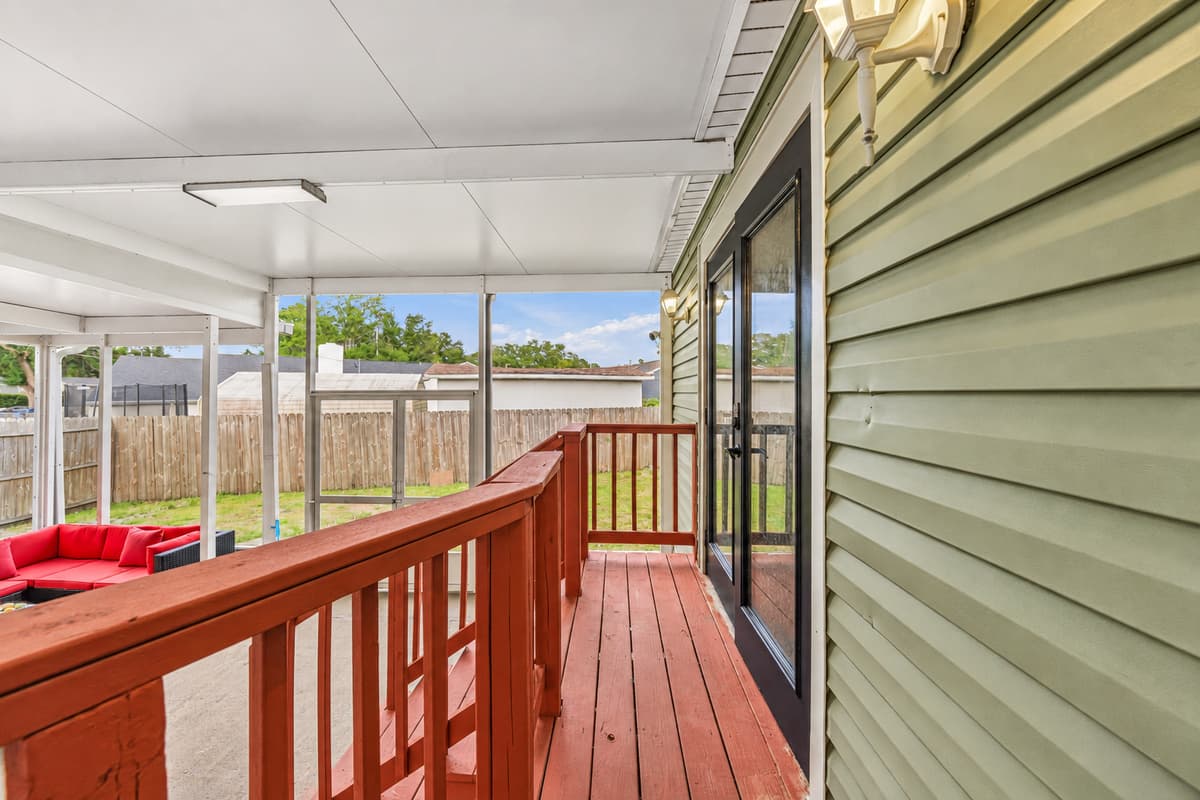 Walkway along the screened patio offering privacy and seamless indoor-outdoor flow.