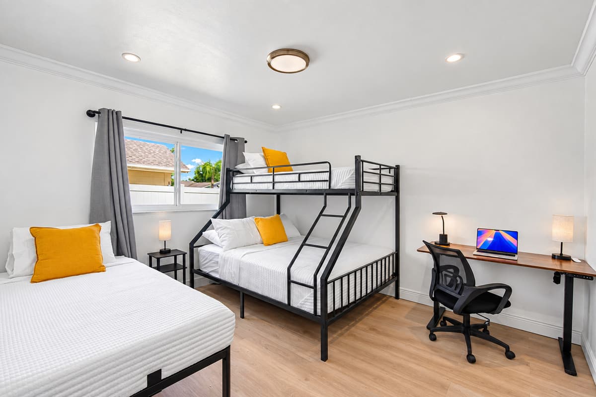 Sleep up to 4 with ease—this room features a twin bed and a twin-over-full bunk for the perfect kid or group setup.
