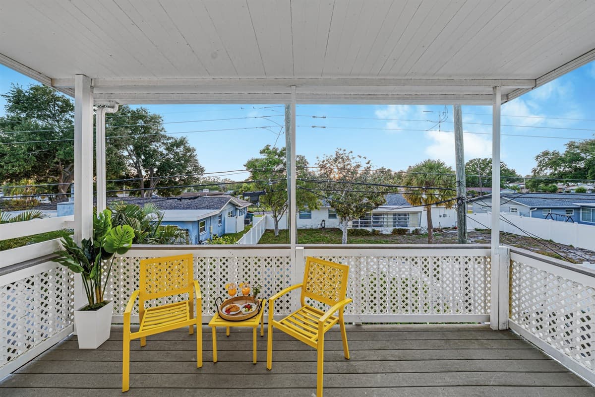 Wide balcony space with seating for multiple guests—perfect for enjoying fresh air and sunshine 