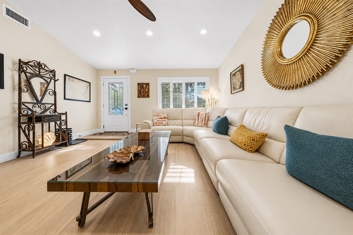 Comfortable open-concept living space featuring stylish furnishings, natural light, and elegant design touches.