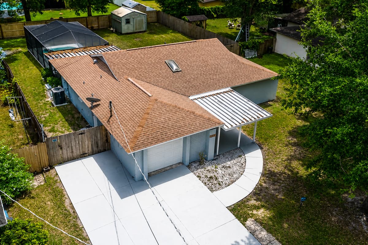 Aerial front view of our lovely property showcasing our beautiful, spacious driveway and our fully fenced backyard where kids can safely play and run around. If you are interested in this property, send us an inquiry now!