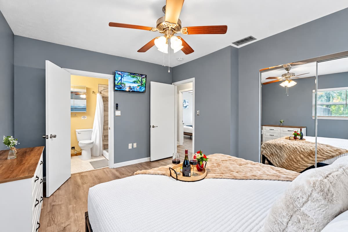 Relax in this spacious king bedroom with a private en-suite bathroom, designed for comfort and privacy.
