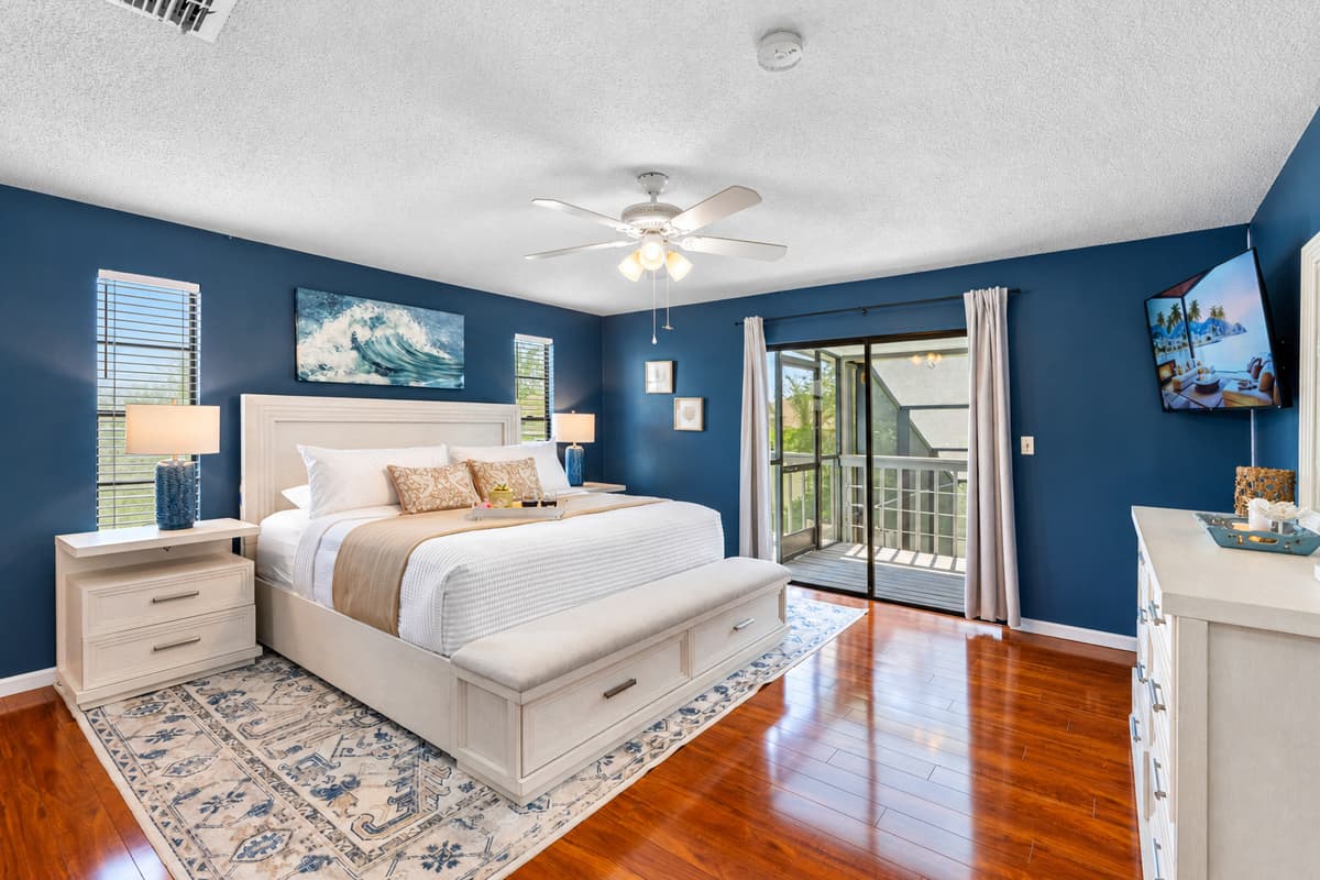 Twin windows frame each side of the bed, letting in natural light while maintaining privacy.