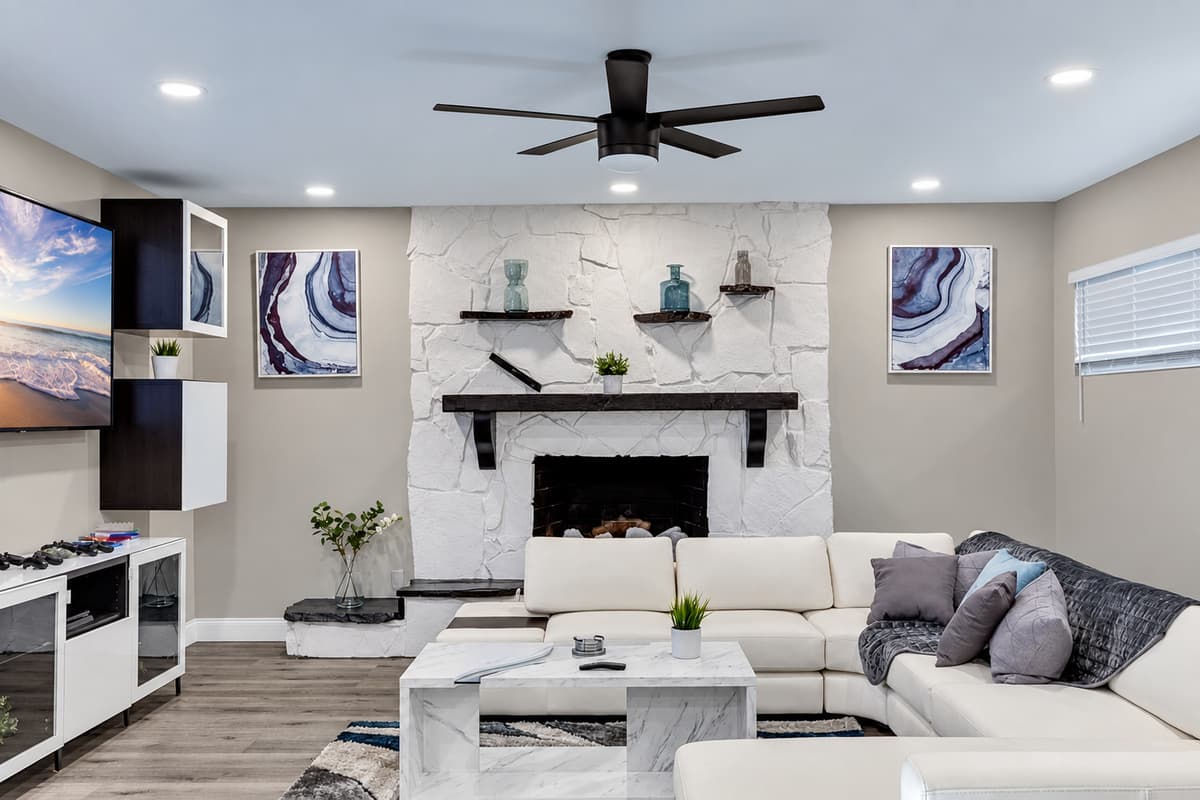 Spacious living room with a beautiful L-Shaped couch where you and your family and friends can bond and relax. 