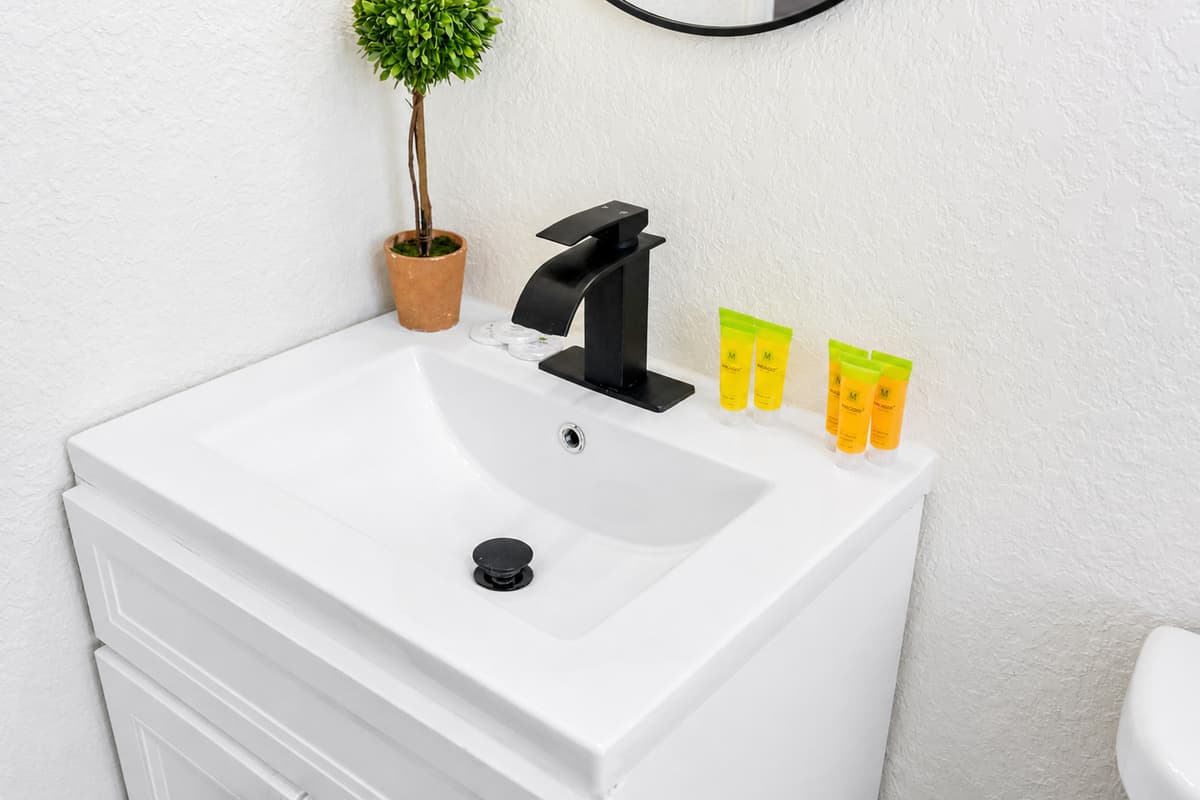 The bathrooms are thoughtfully appointed with contemporary fixtures, clean lines, and calming neutral tones, creating a serene environment that feels fresh and inviting.