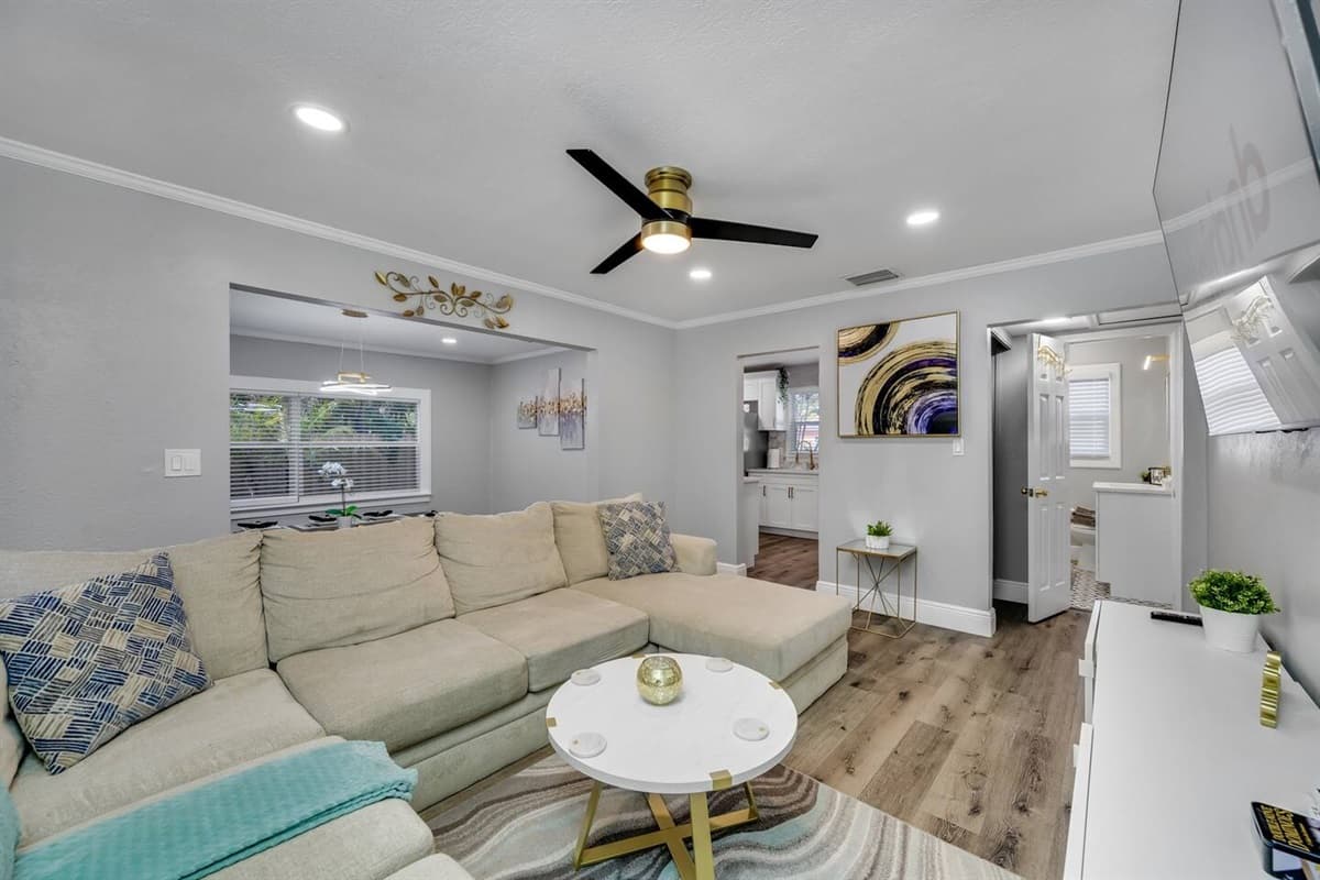 Amazing living room with L-Shaped modern couch where you could relax and enjoy.