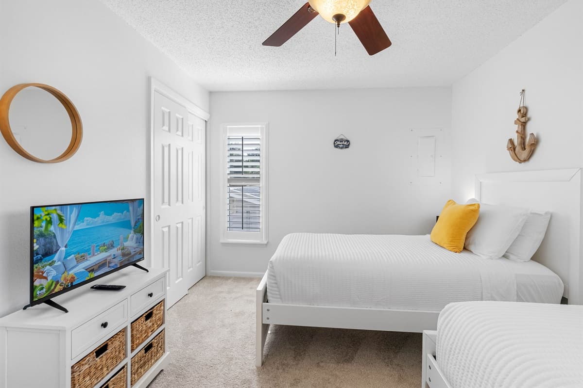 Two comfy twin beds create the ideal space for a cozy night’s sleep.