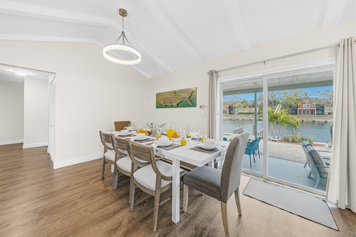 Elegant dining table set for memorable meals overlooking the water.
