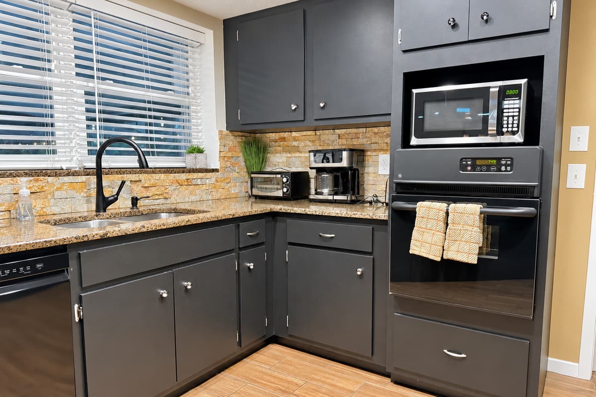 From a built-in oven to a microwave, toaster, coffee maker, and blender, this kitchen is stocked with all the essentials for cooking, baking, and snacking in comfort.