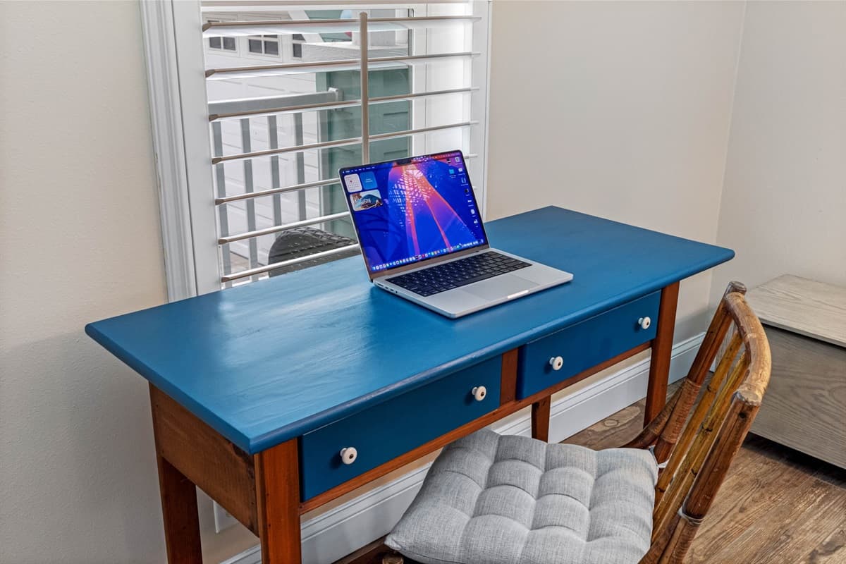 Need to catch up on emails or work remotely? This charming desk setup offers plenty of natural light, a comfortable chair, and a peaceful atmosphere ideal for productivity.