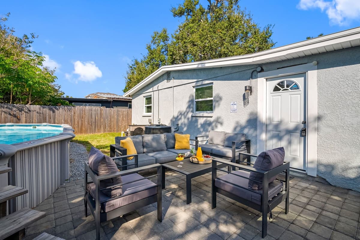 The backyard’s open layout and shaded areas make it a perfect space to enjoy the day.