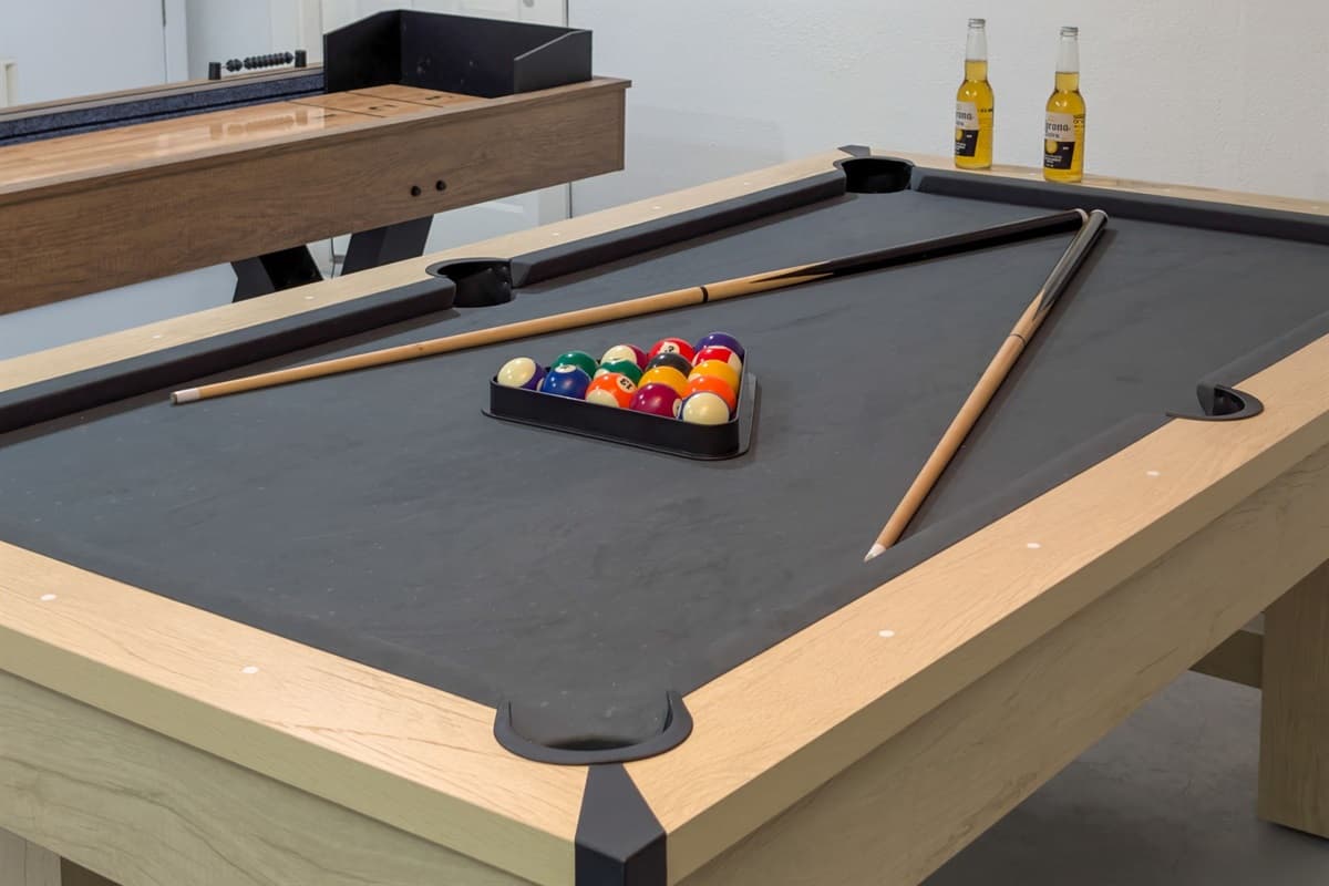 Whether you're sinking shots at the pool table or getting in a quick workout, this all-in-one space is designed for fun and fitness.