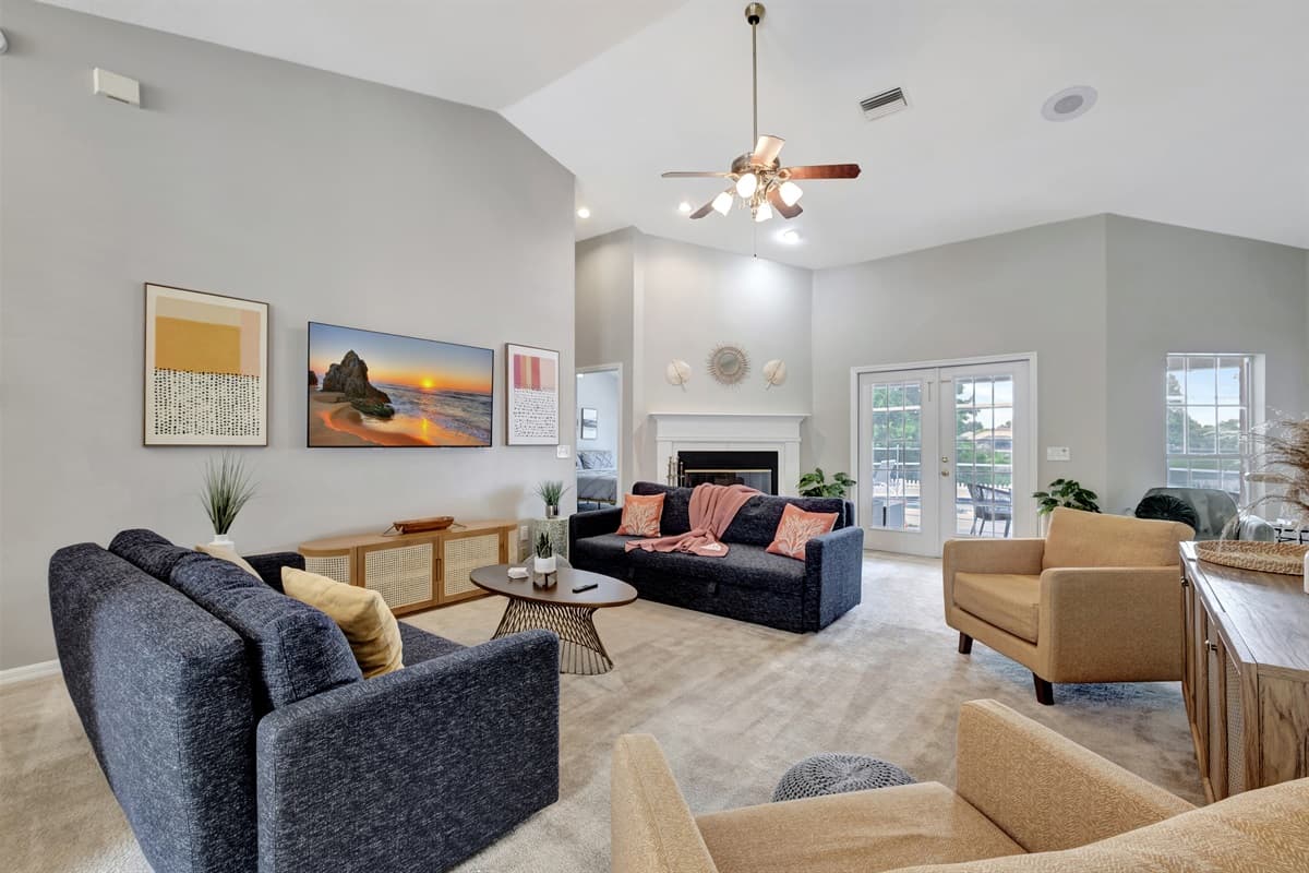 Two luxurious dark blue sofas take center stage, offering ample seating for relaxation and socializing.