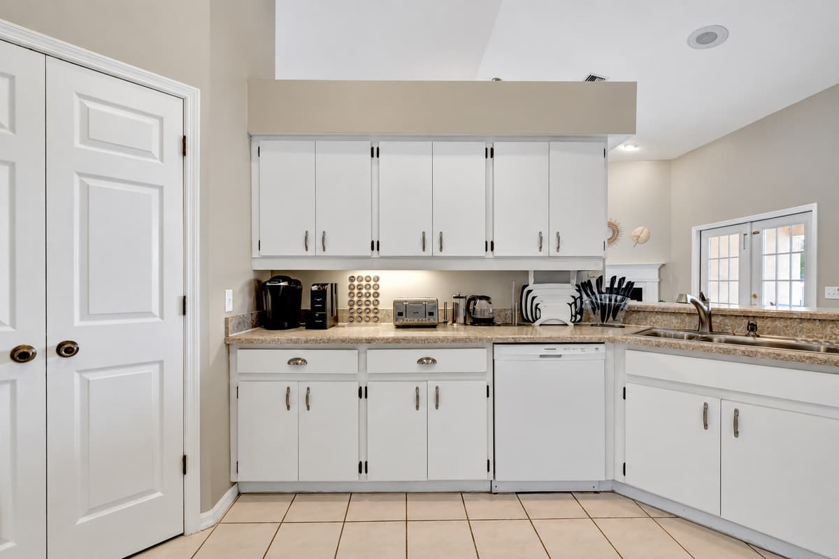 Welcome to our stunning kitchen. The meticulously crafted wooden cupboards provide ample storage space, combining practicality with aesthetic appeal.