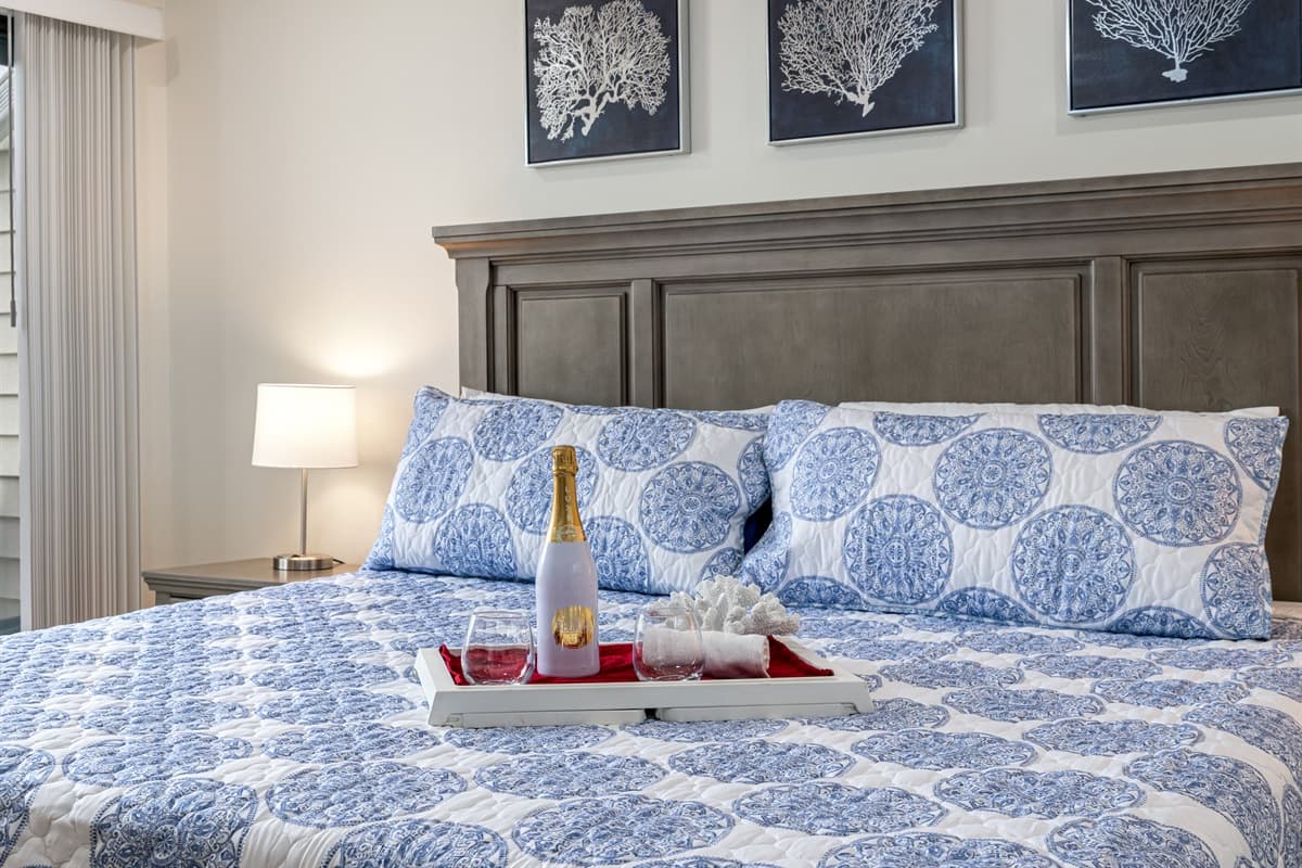 The king-size bed invites you to indulge in a night of serene sleep, enveloped in soft linens and plush pillows.