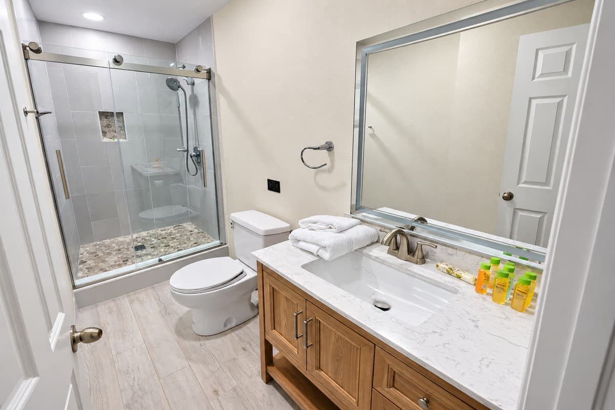 The light wood-look flooring and neutral color palette create a calm and welcoming atmosphere.