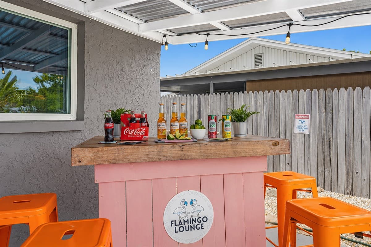 Additional bar seating area with a casual, laid-back vibe for gathering outdoors.