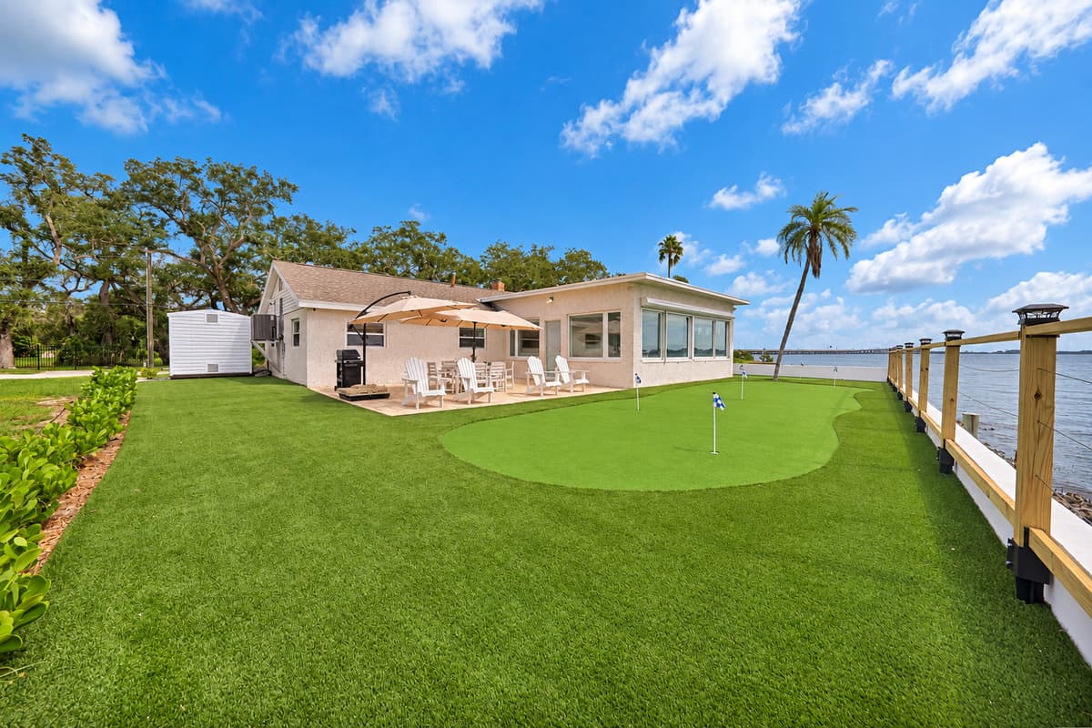 Putting green, patio and sunroom. The backyard flows from the patio to the turf green and the sunroom windows. Everything you want outdoors, in one place.
