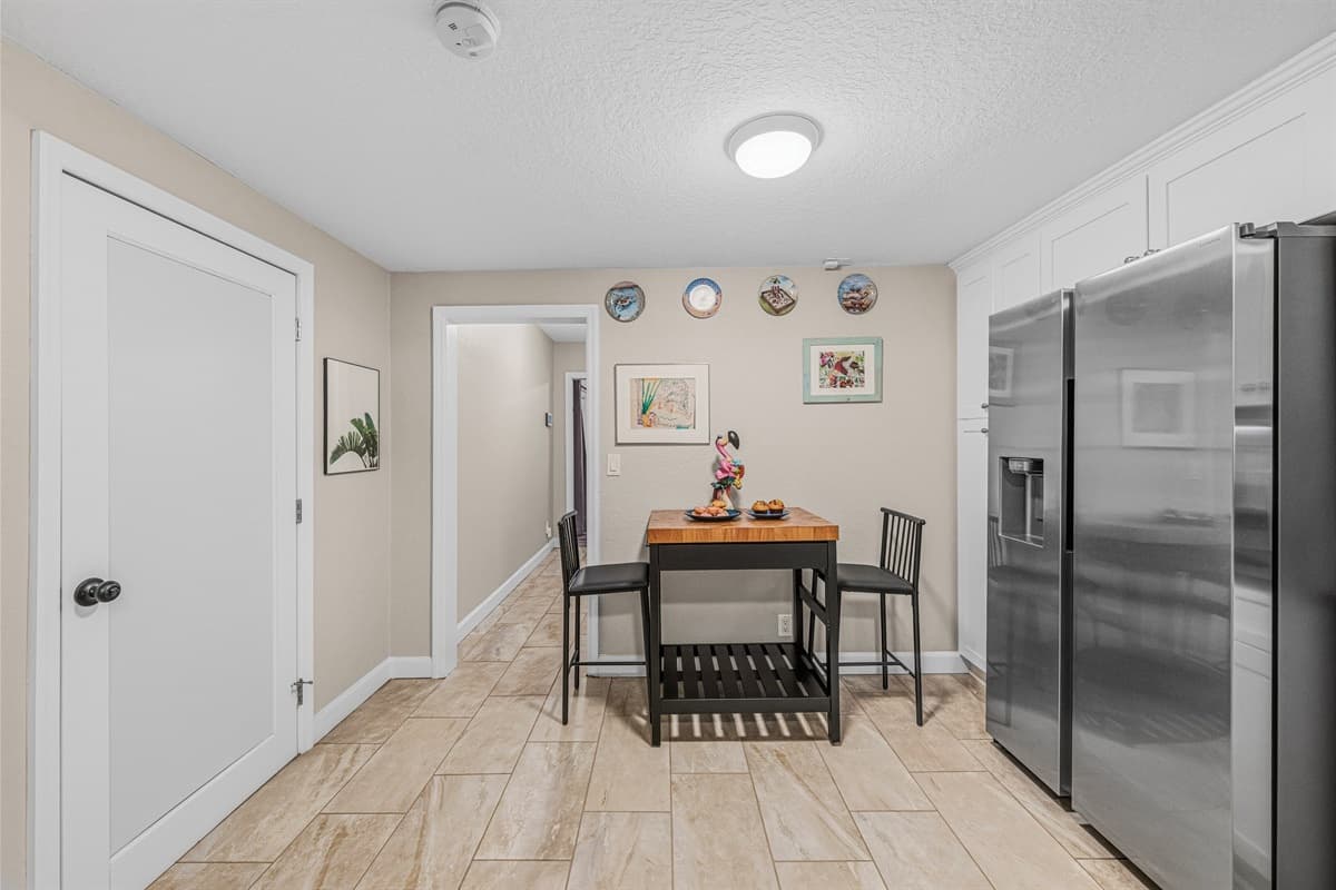 Cozy breakfast nook with seating for casual meals, coffee, or quick bites.