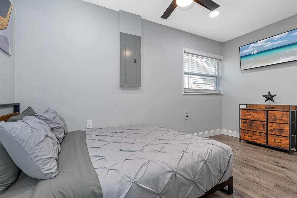 Watch movies in the comfort of your own bedroom while on this trip! This bedroom has a queen-sized bed, drawers for storage, and a smart TV! Book now!