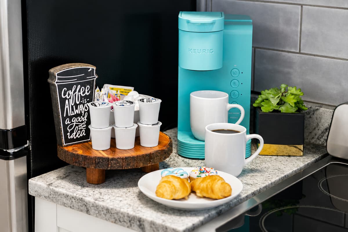 Wake up to a convenient coffee station with a Keurig brewer, coffee pods, mugs, and everything you need for a relaxing morning.