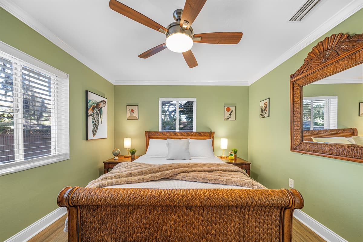 Unwind in this comfortable queen bedroom, complete with soft linens and charming details.