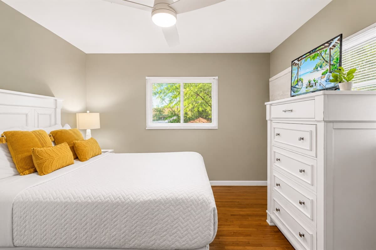 Bright and inviting bedroom with modern furnishings, natural light, and a relaxing atmosphere.