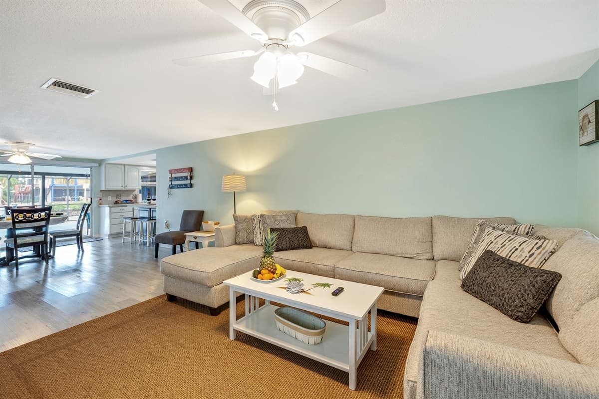 Natural light filters through strategically placed windows, accentuating the tasteful decor and creating a warm, inviting glow.