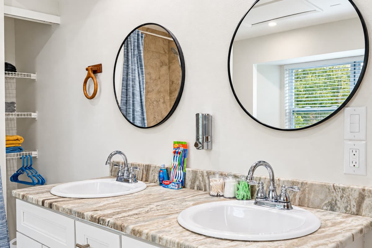 The his and her sinks provide a touch of opulence and convenience. With spacious countertops and ample storage below, you'll have plenty of room to keep your personal items organized and easily accessible.