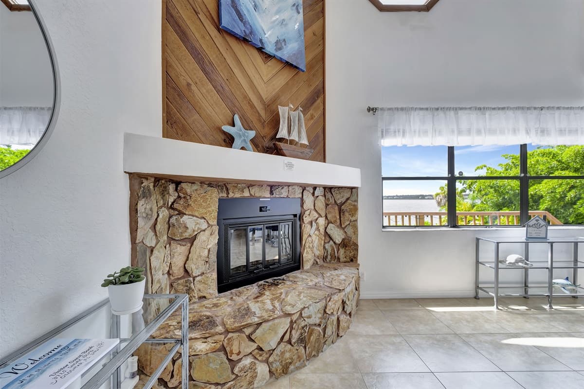 At the heart of this space lies a cozy fireplace, radiating warmth and creating a captivating ambiance that invites you to unwind and linger a while longer.