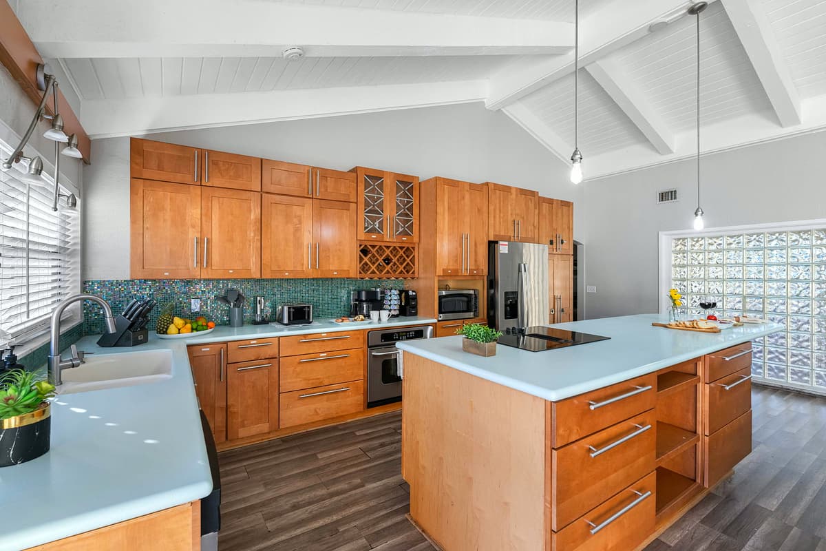 Beautiful wooden cabinetry and sleek finishes bring together classic warmth and modern functionality.