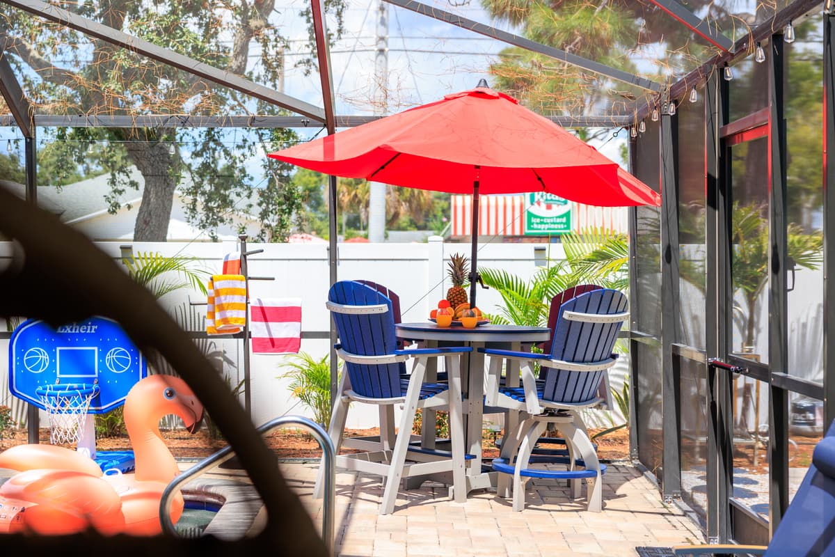 Screened-in pool and outdoor lounge space.