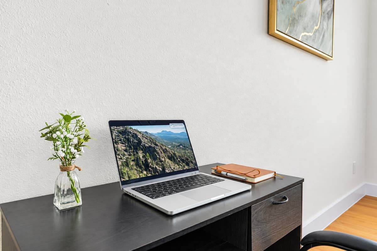 Close-up of workspace with desk and laptop—perfect for remote work.