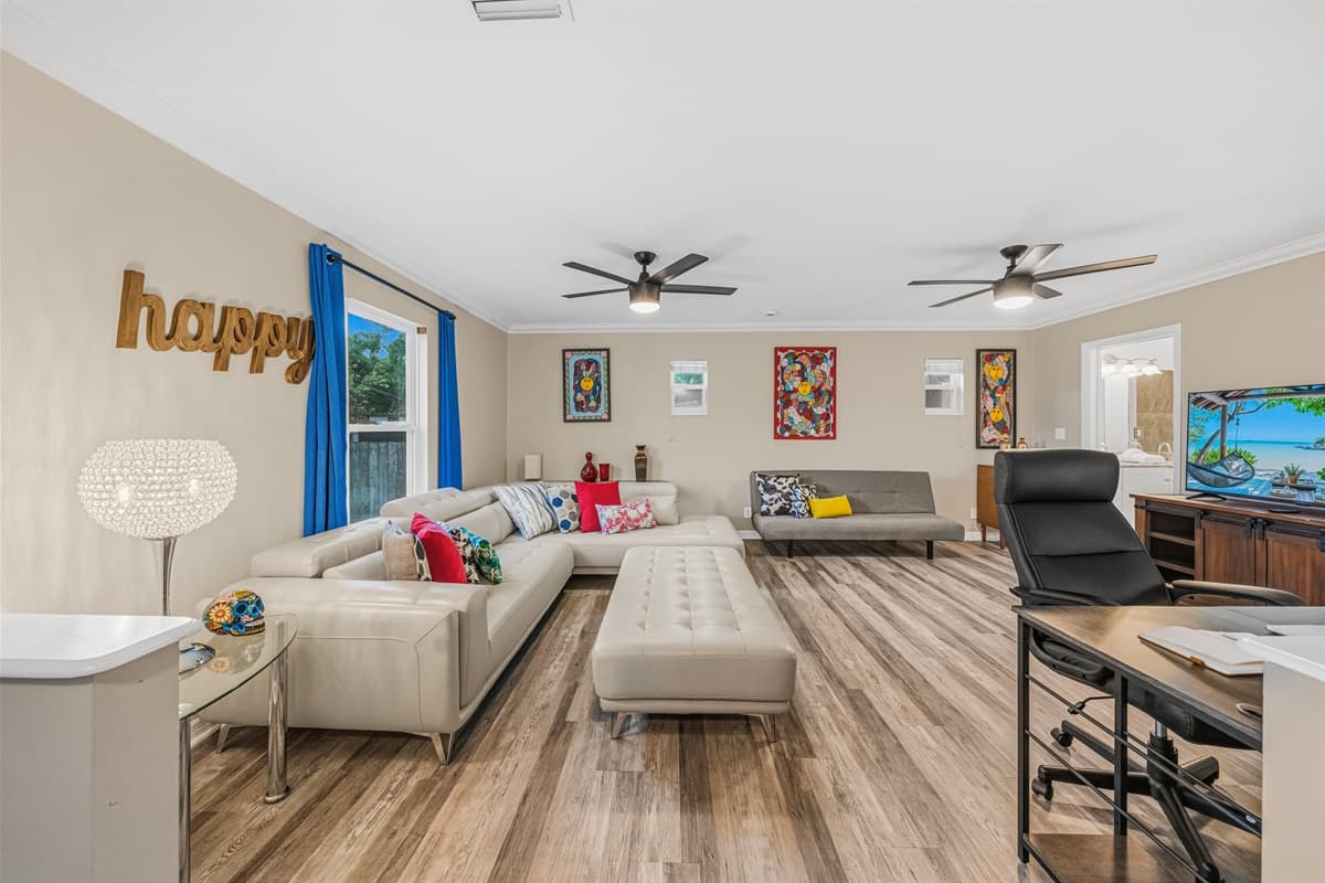 Wide-angle view of the main living area showcasing generous seating, open design, and welcoming atmosphere.