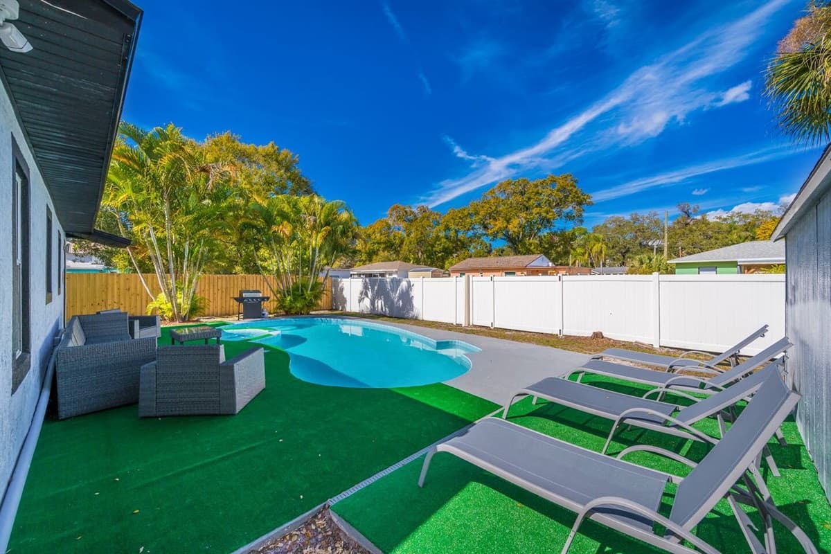 Beautiful fully fenced backyard with magnificent heated pool with seating area.