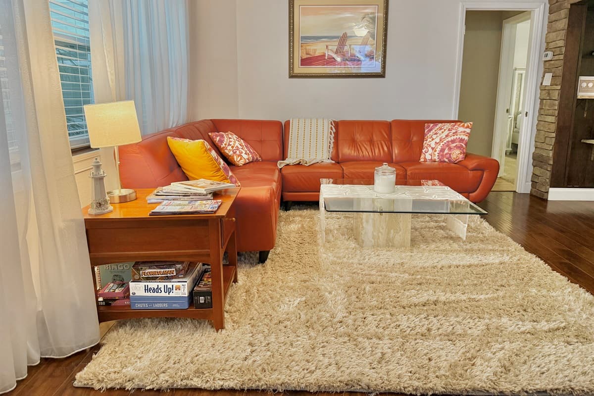 Sunlight pours through large windows, creating a bright and tranquil vibe in this thoughtfully designed lounging area.