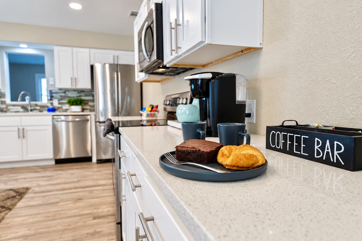 The well-organized cabinets and countertops provide ample storage and workspace for meal preparation and cooking.