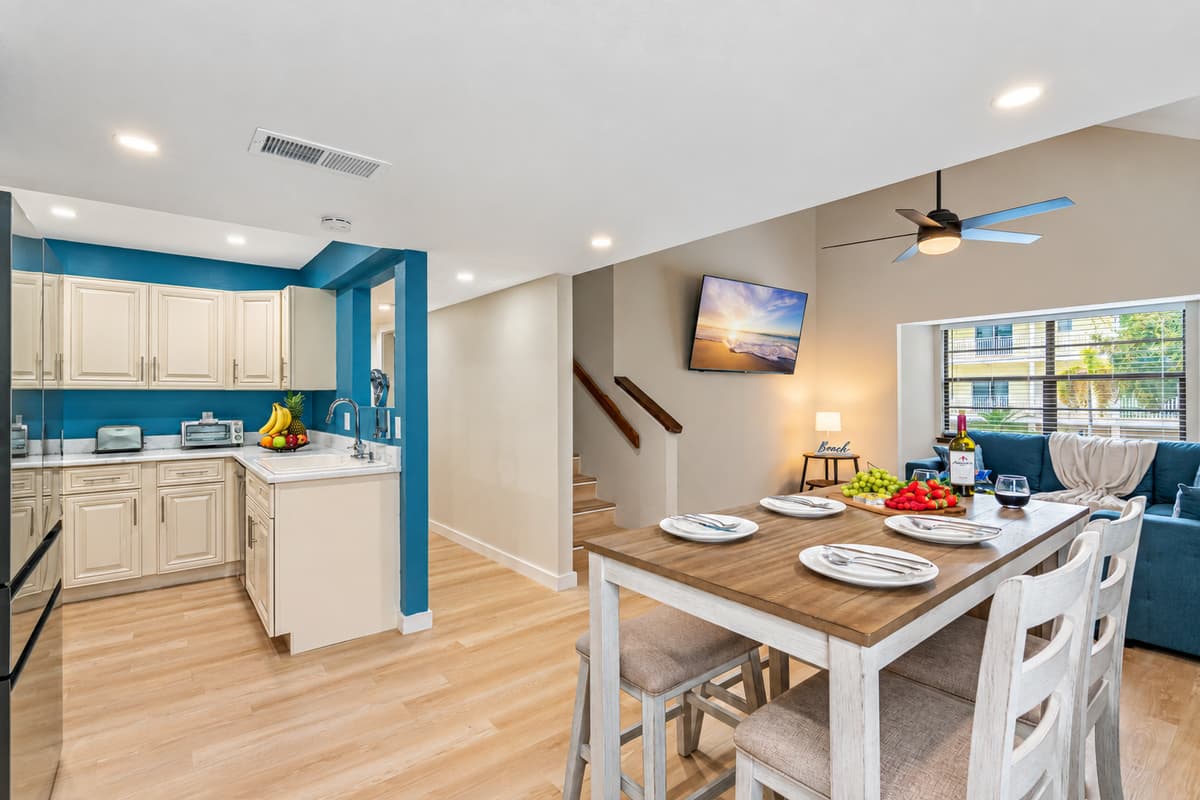 A beautiful wooden 4-seater table awaits, exuding a natural charm and timeless elegance. The smooth, polished surface beckons you to gather around and share delicious meals with family and fri