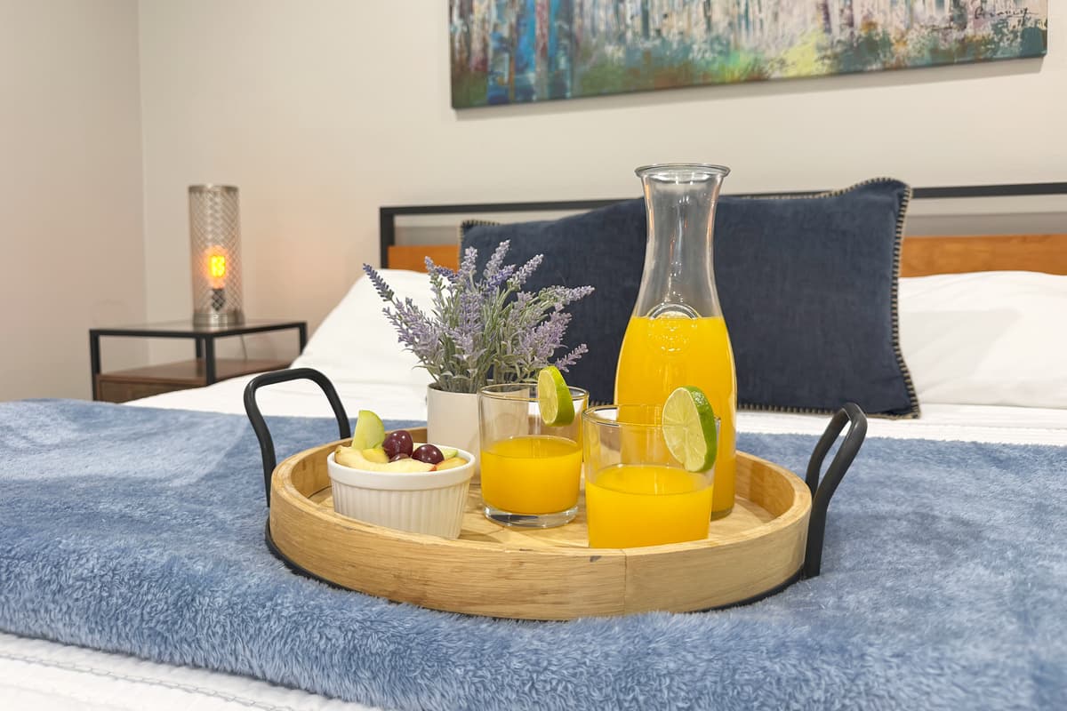 Breakfast served right on the bed, this is the photo that makes "just one more night" feel tempting.