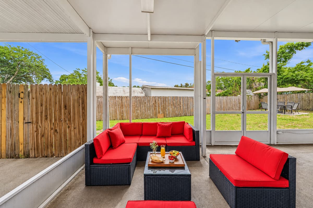 Spacious screened patio with lounge seating—perfect for relaxing evenings or morning coffee.