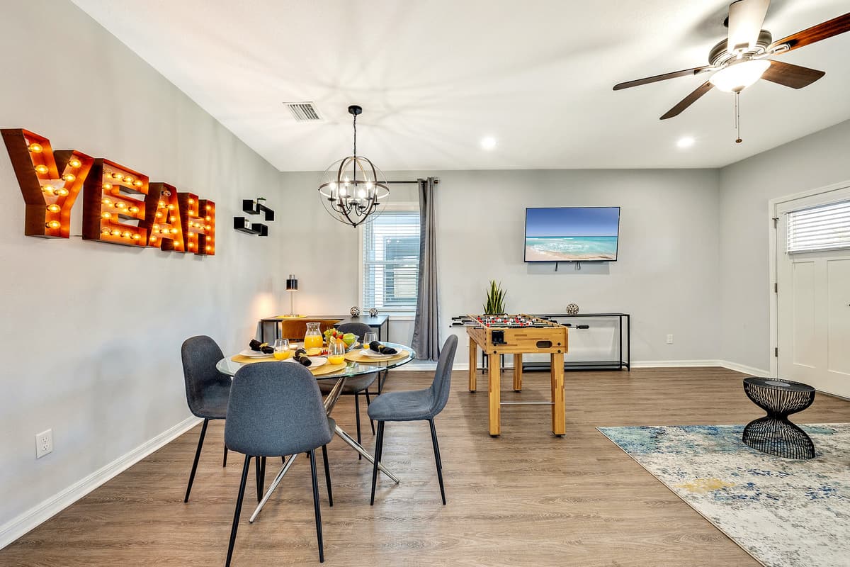 The attention to detail extends beyond the table, with subtle decor elements adding to the overall charm of the room.
