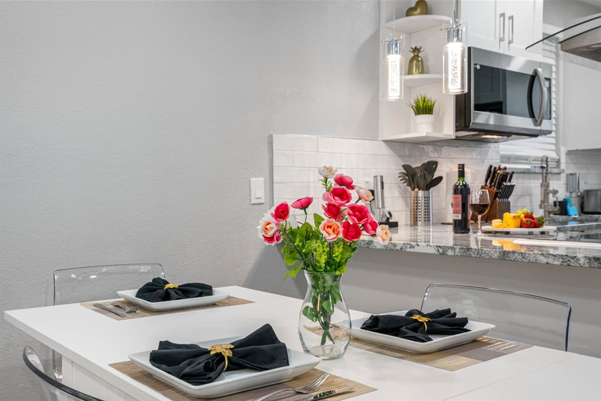 Just across from the kitchen, you'll find our inviting dining area, centered around a beautiful 4-seater dining table.