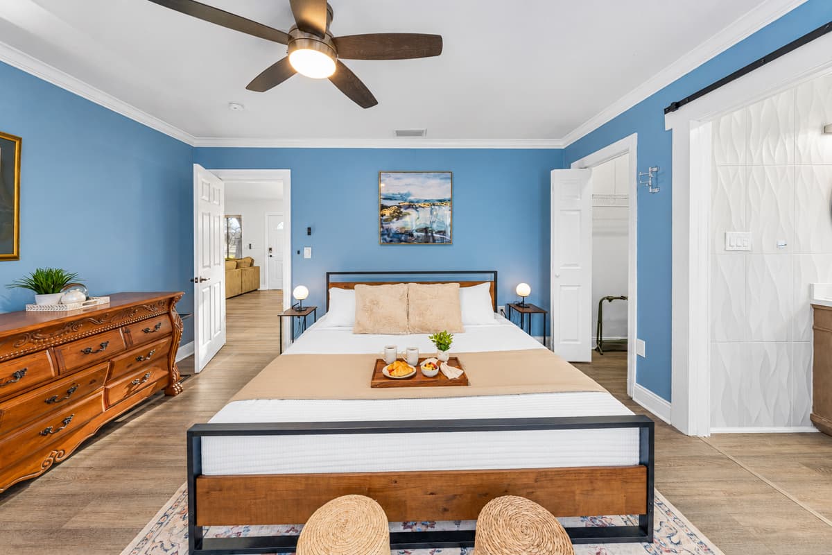 The king-size bed anchors this inviting bedroom, offering plush comfort and a peaceful ambiance.