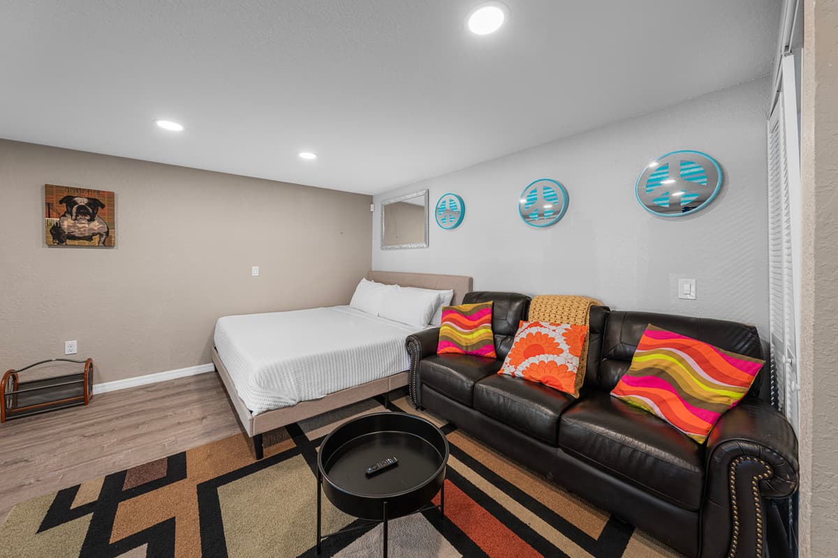Bright and inviting living room with plush sectional seating, stylish décor, and plenty of space to relax. — photo 51
