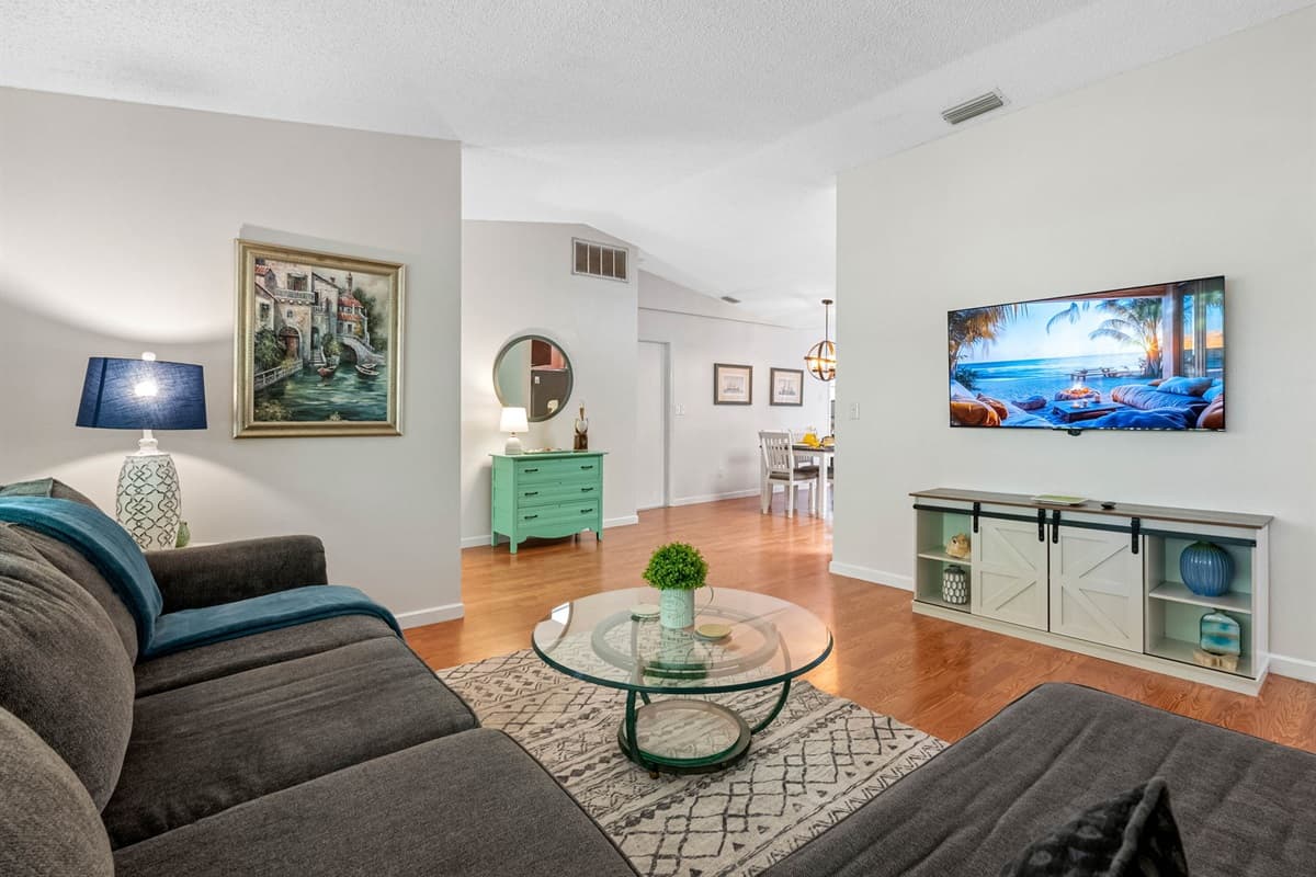 The comfortable lounging couch create an inviting atmosphere, perfect for unwinding after a long day or hosting memorable movie nights with loved ones.