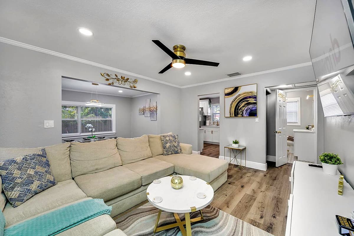 Amazing living room with L-Shaped modern couch where you could relax and enjoy.