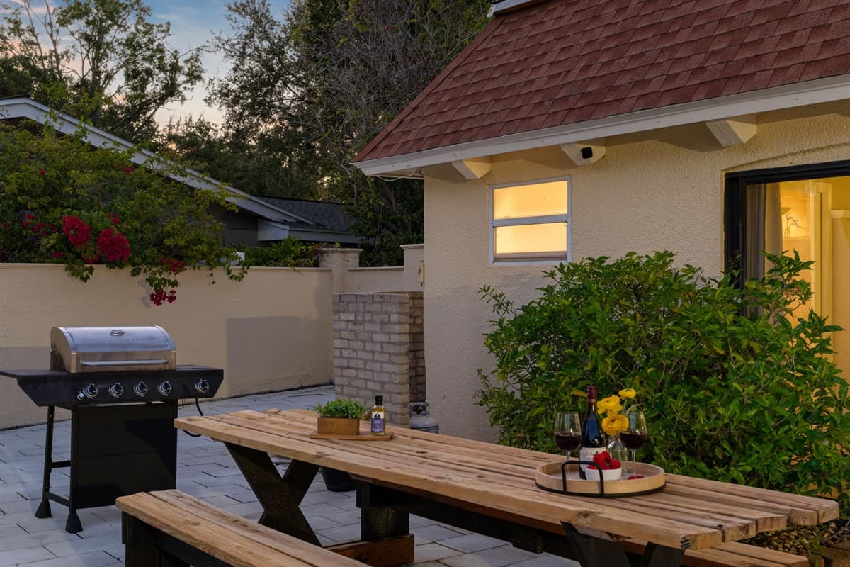 Gather around the rustic picnic table for meals fresh off the grill, just steps away from the shimmering pool.